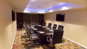 a conference room with a long table and chairs at Holiday Inn Express Bakersfield, an IHG Hotel in Bakersfield