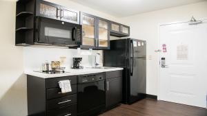 A kitchen or kitchenette at Candlewood Suites Bay City, an IHG Hotel