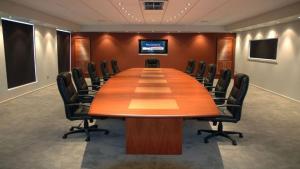 a conference room with a large wooden table and chairs at Holiday Inn Express & Suites Blackwell by IHG in Blackwell