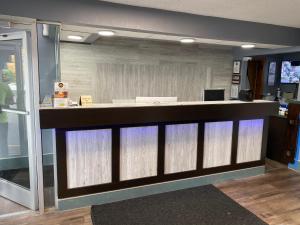 an office lobby with a reception counter with lights at Knights Inn Nashville Antioch in Antioch