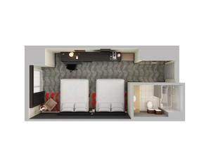 a floor plan of a room with two chairs at Holiday Inn Express & Suites Naples Downtown - 5th Avenue by IHG in Naples