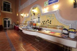 a buffet line in a restaurant with food on display at Holiday Inn Express Guanajuato by IHG in Guanajuato