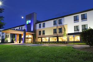 a large white building with lights on at Holiday Inn Express Brentwood-South Cool Springs, an IHG Hotel in Brentwood