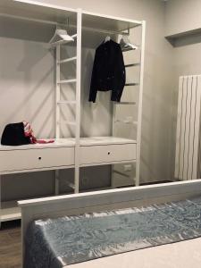 a closet with a mirror and a dresser at Classic Home in Castelbuono