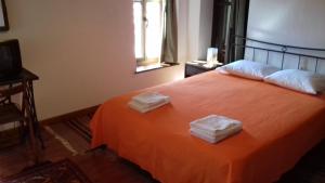 En eller flere senger på et rom på Guesthouse Ventista-Ξενώνας