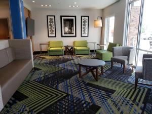 a waiting room with chairs and a couch and a table at Holiday Inn Express & Suites Nashville North - Springfield by IHG in Springfield