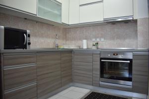 Kuchyň nebo kuchyňský kout v ubytování Apartman BoNi