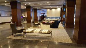 a lobby of a hotel with a couch and chairs at Crowne Plaza - Chicago West Loop, an IHG Hotel in Chicago