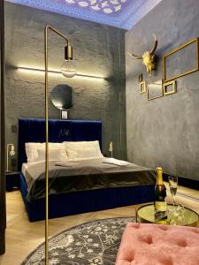 a bedroom with a bed and a lamp at Noble Boutique Hotel - Adults Only in Budapest