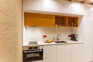 A kitchen or kitchenette at SCA Sofia City Apartments