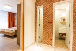 A bed or beds in a room at SCA Sofia City Apartments