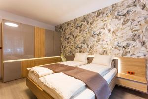 A bed or beds in a room at SCA Sofia City Apartments