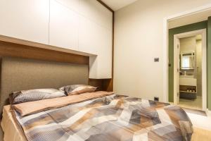 A bed or beds in a room at SCA Sofia City Apartments