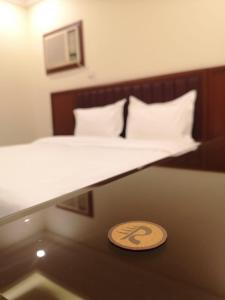Letto o letti in una camera di فندق روشن Roshan Hotel
