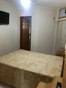 Ένα ή περισσότερα κρεβάτια σε δωμάτιο στο Millenium Thermas