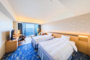 Postelja oz. postelje v sobi nastanitve Atami Korakuen Hotel