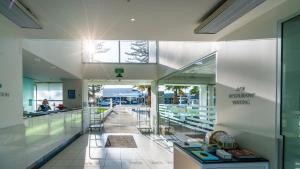 a view of a shopping mall with glass windows at Scenic Hotel Te Pania in Napier