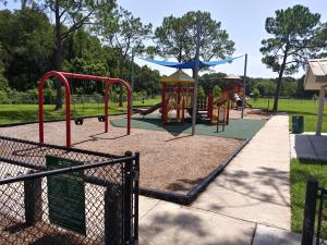 a park with a playground with a slide at Tampa Citrus Park in Tampa