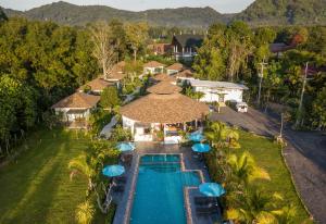 an aerial view of a resort swimming pool with umbrellas at Aonang Eco Villa in Ao Nang Beach