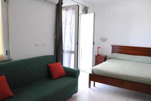 Vuode tai vuoteita majoituspaikassa Guest House Sea Rooms Alghero
