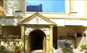 an entrance to a building with an archway at Cubbon Suites - 10 Minute walk to MG Road, MG Road Metro and Church Street in Bangalore