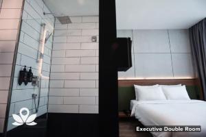 Postel nebo postele na pokoji v ubytování Ceria Hotel