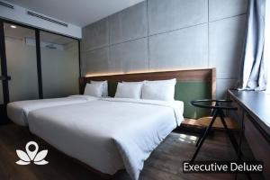 Postel nebo postele na pokoji v ubytování Ceria Hotel