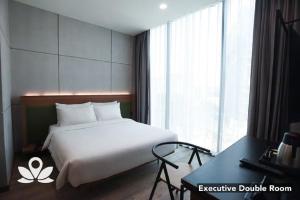 Postel nebo postele na pokoji v ubytování Ceria Hotel