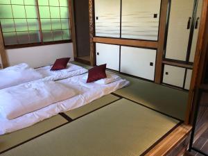Giường trong phòng chung tại Cool-Cottage Otaru OTAMOI