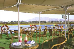 a group of tables and chairs under a tent at Jaz Crown Prince Nile Cruise - Every Monday from Luxor for 07 & 04 Nights - Every Friday From Aswan for 03 Nights in Luxor