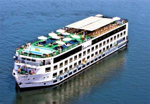 a cruise ship in the water with people on it at Jaz Crown Prince Nile Cruise - Every Monday from Luxor for 07 & 04 Nights - Every Friday From Aswan for 03 Nights in Luxor