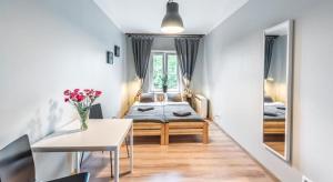 Posteľ alebo postele v izbe v ubytovaní Fenna Apartments 7 minut od Rynku