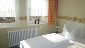 מיטה או מיטות בחדר ב-Hotel Landhaus Lahmann