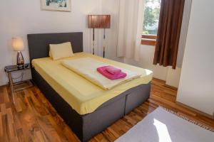 Katil atau katil-katil dalam bilik di Hotel Rosmann