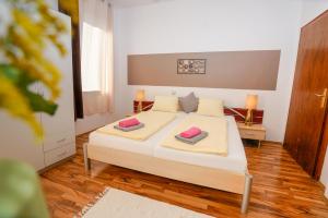 Katil atau katil-katil dalam bilik di Hotel Rosmann