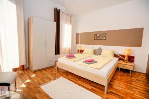 Katil atau katil-katil dalam bilik di Hotel Rosmann