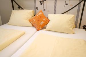 Katil atau katil-katil dalam bilik di Hotel Rosmann