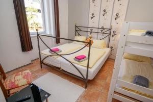 Katil atau katil-katil dalam bilik di Hotel Rosmann