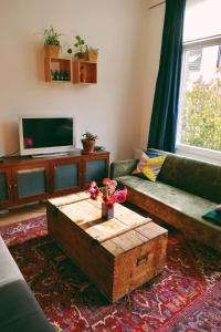 a living room with a couch and a coffee table at 130sqm appartment with 20sqm terras and free parking in Antwerp