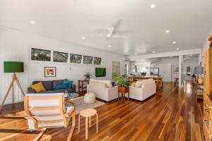 a living room with a couch and a table at The Keepers House in Toowoomba