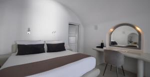 Ένα ή περισσότερα κρεβάτια σε δωμάτιο στο Pegasus Suites & Spa