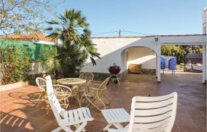 A patio or other outdoor area at Stunning Home In Miami-Platja With Wifi