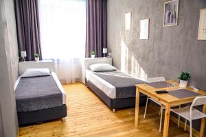 Кровать или кровати в номере Home Hotel