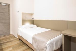 Postel nebo postele na pokoji v ubytování Hotel Baia di Paré