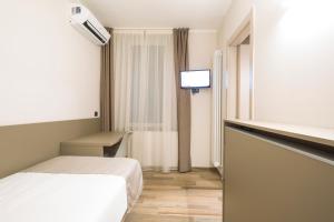 TV a/nebo společenská místnost v ubytování Hotel Baia di Paré