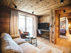 TV a/nebo společenská místnost v ubytování Boutiquehotel Blaue Burg Falkenstein