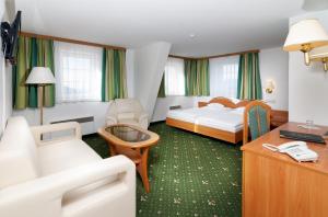 Posteľ alebo postele v izbe v ubytovaní Hotel Spindlerova Bouda