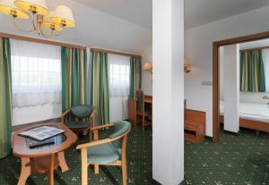 Posteľ alebo postele v izbe v ubytovaní Hotel Spindlerova Bouda