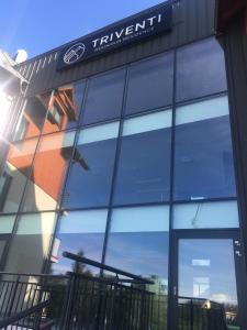 a building with a sign on the front of it at Apartament Silence Triventi Agat in Karpacz