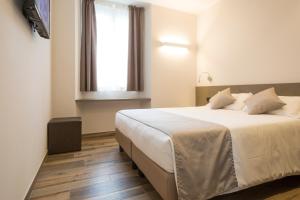 Postel nebo postele na pokoji v ubytování Hotel Baia di Paré